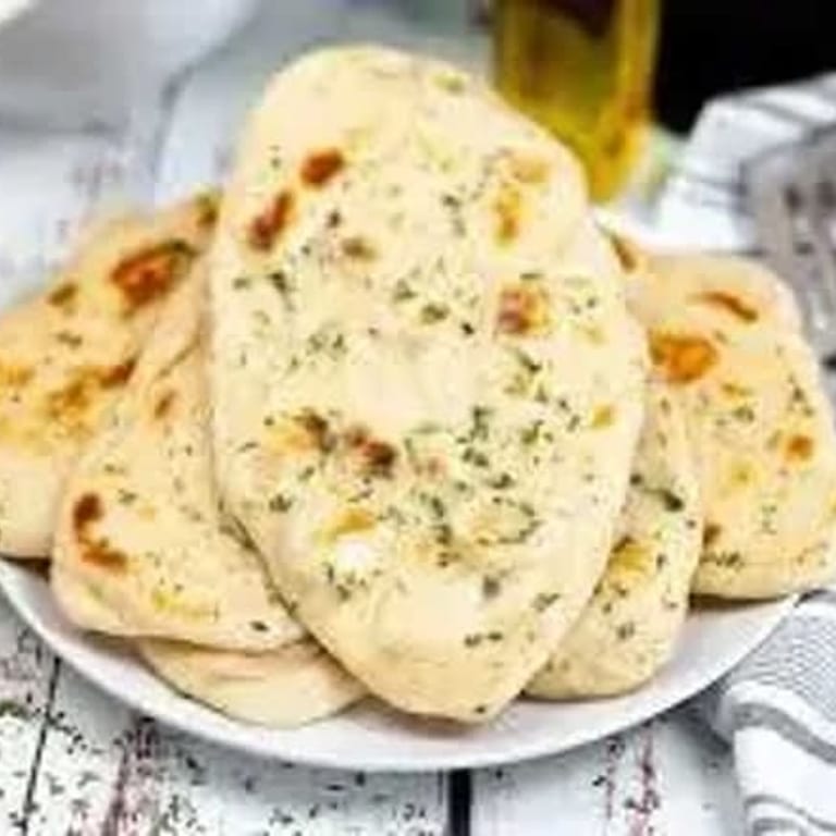 Delicious Garlic Naan and Indian Cuisine Favorites